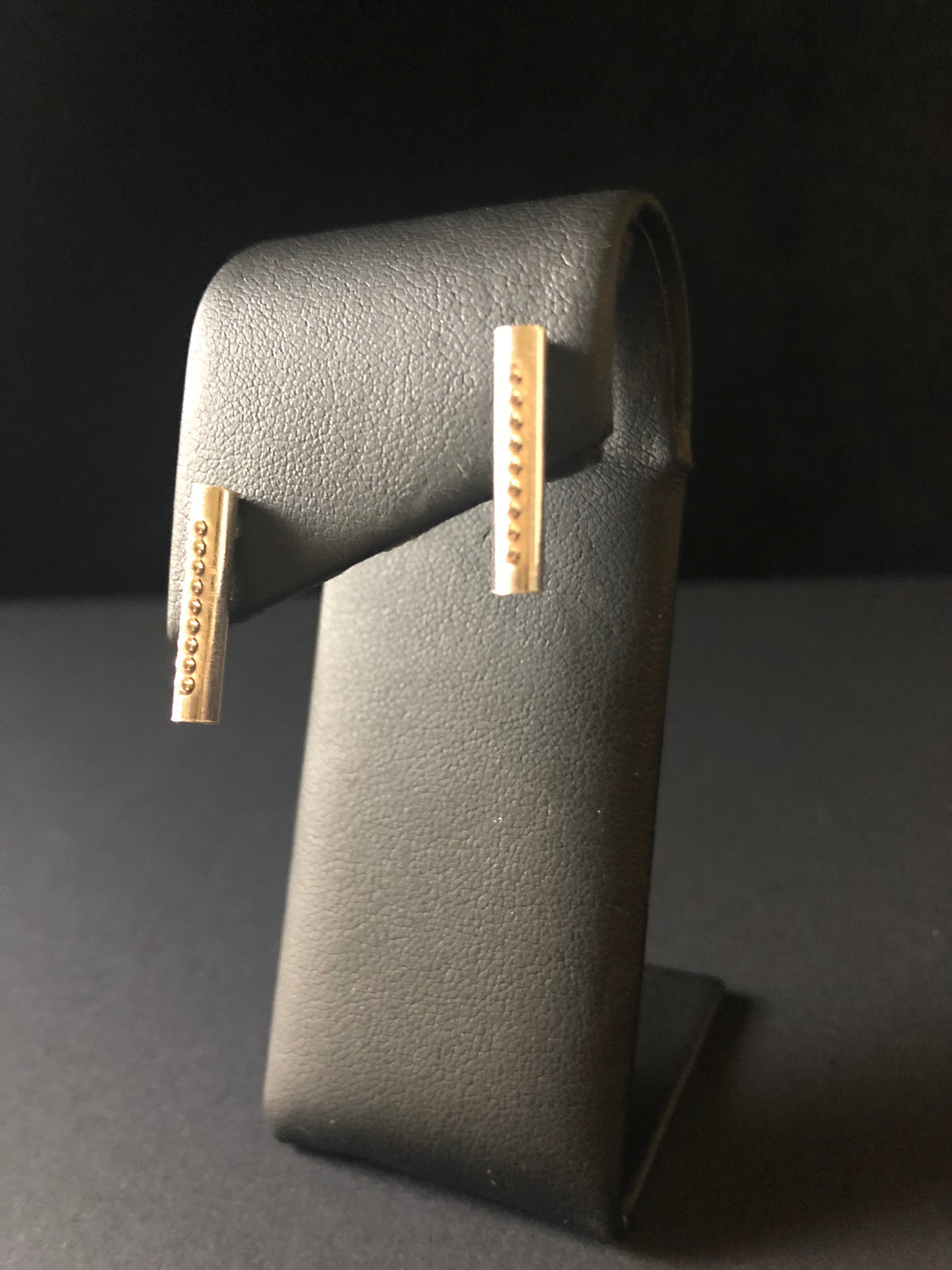 Swinger stud earrings